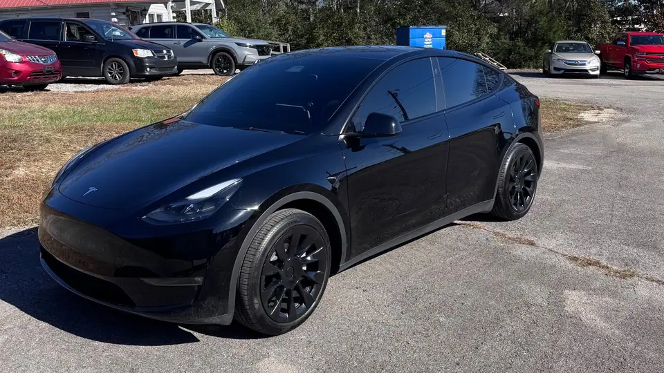 Blacked-out Tesla Model Y in the lot at the Stealth Tint and PPF shop