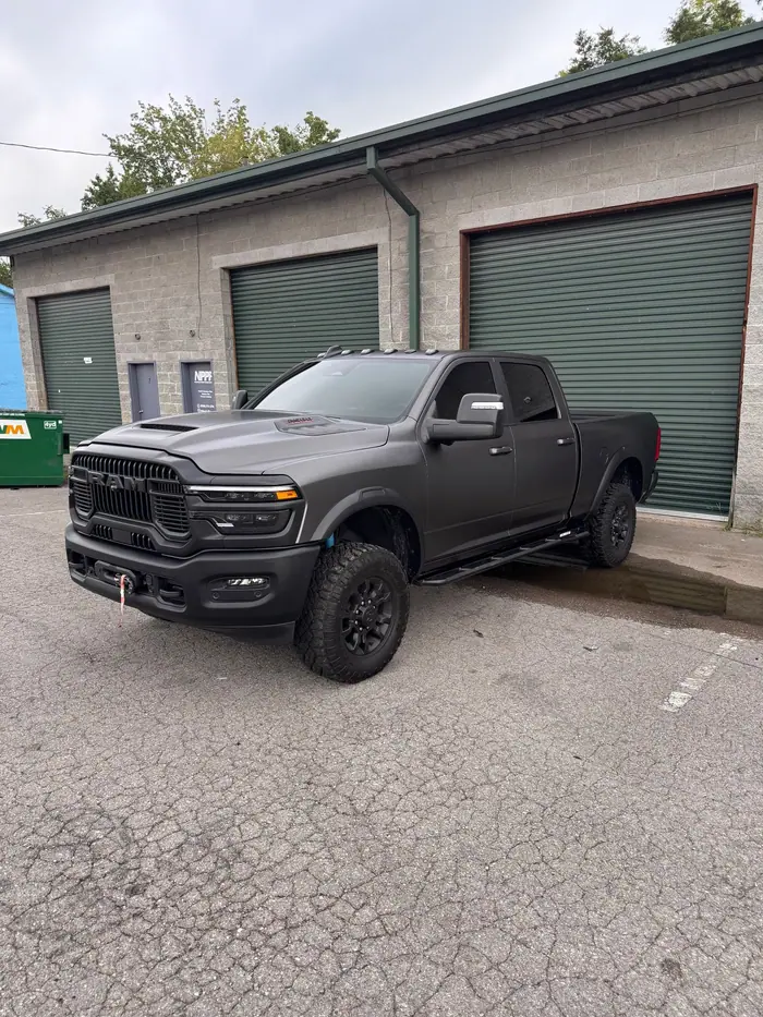 Dark gray RAM 2500 pickup with tinted windows