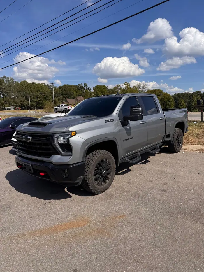 Gray Chevrolet Silverado 2500 HD with tinted windows